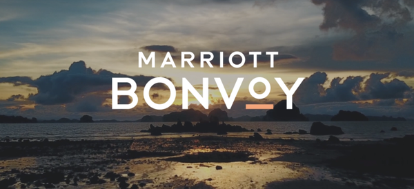 Marriott Bonvoy Logo with a beach background.